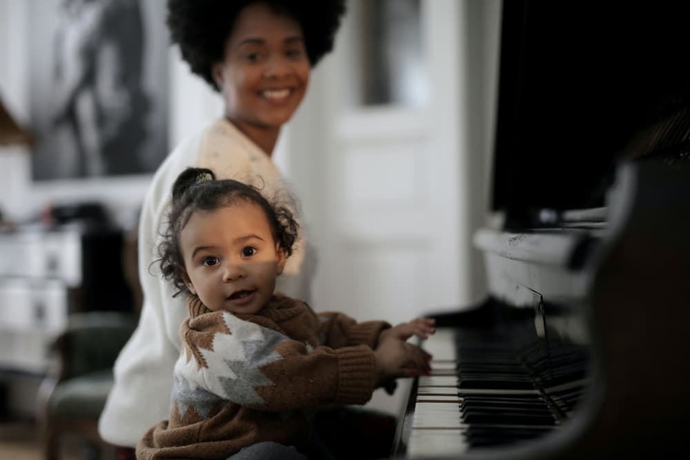 small kid is playing piano